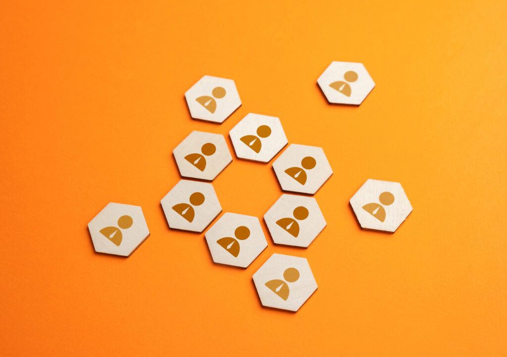 Hexagonal wooden tiles with user icons arranged in a connected loop on an orange background, representing a streamlined payer enrollment pipeline and secure healthcare data sharing.