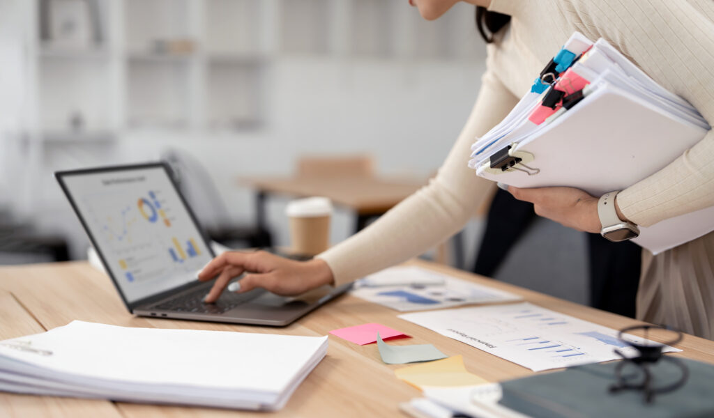 Overworked project lead handling paperwork and project scope management to prevent architecture team burnout