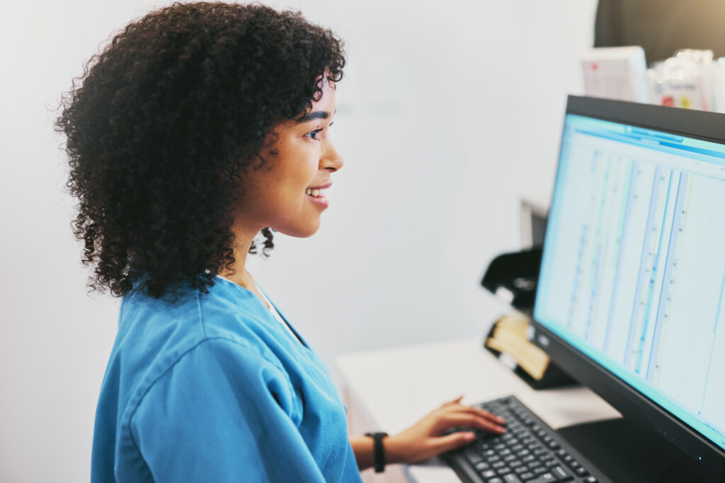Healthcare professional updating electronic health records to improve clinical documentation and streamline prior authorization appeals