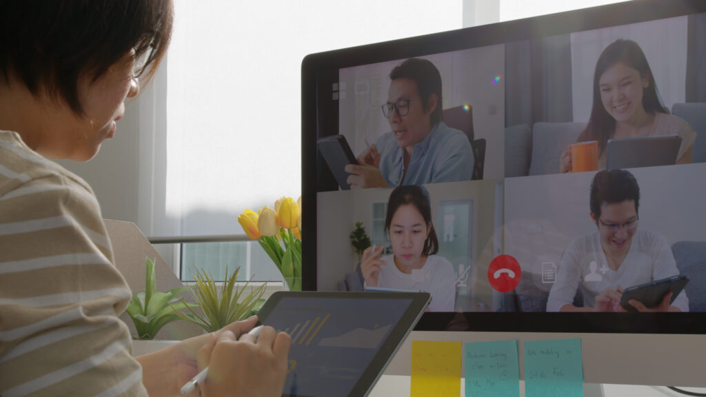 Remote team collaborating in real time during a live video conference call in US business hours