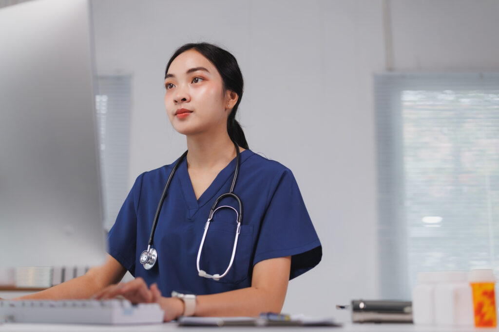 Healthcare professional calculating procedure costs and managing denial prevention for specialty clinic dedicated remote staffing